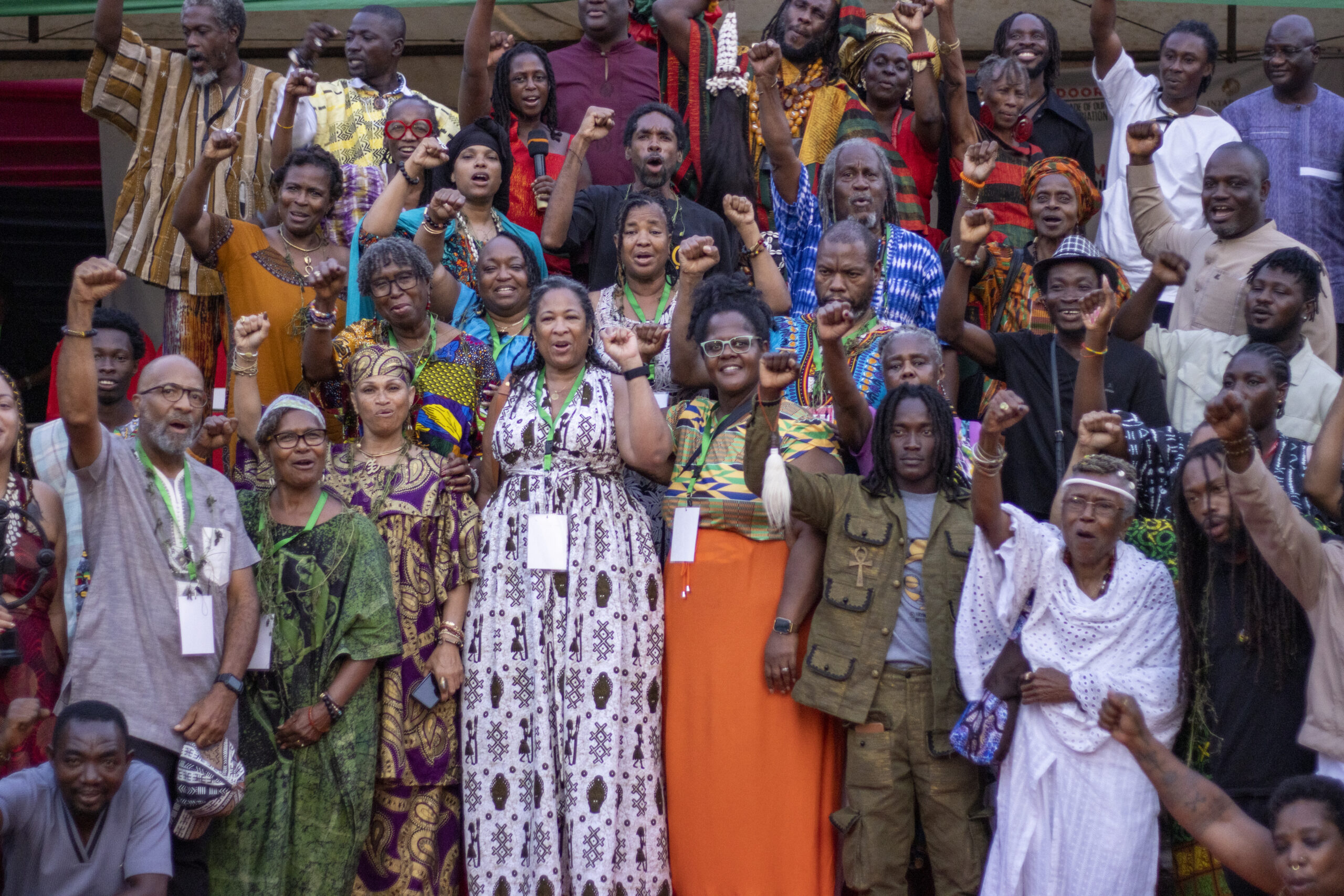 Abibitumi gathering in Ghana with Black cultural procession and red, black, and green visual energy.